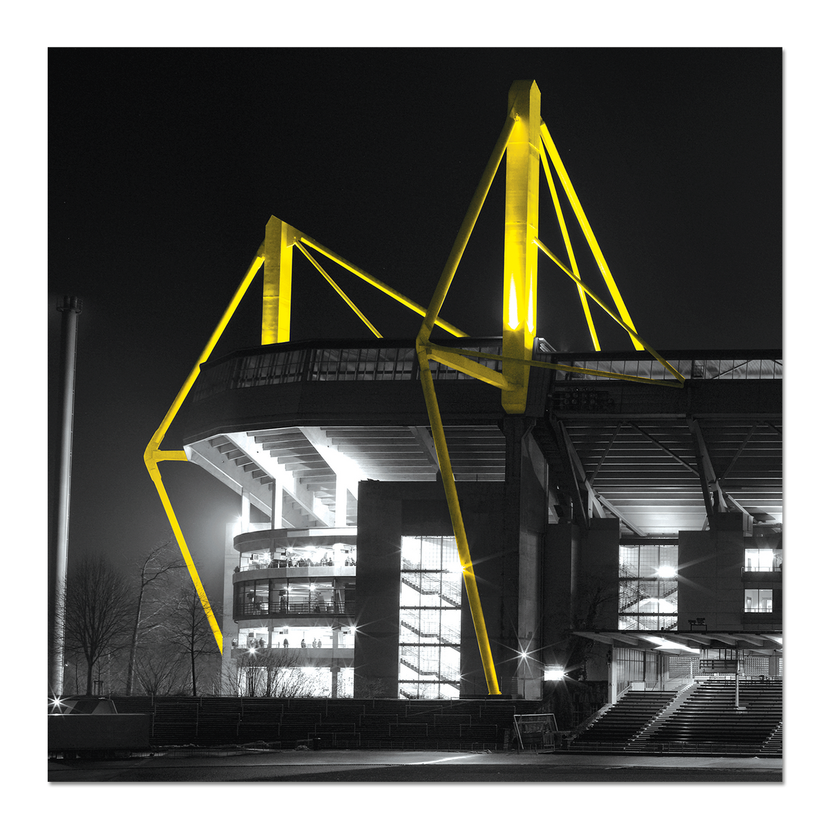 Künstlerischer Druck des SIGNAL IDUNA PARKs bei Nacht mit gelbleuchtenden Stadionstreben und schwarzweißer Darstellung.
