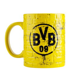 Yellow Borussia Dortmund mug featuring the club's distinctive black-and-yellow logo and a brick pattern—perfect for fans as an accessory or gift.