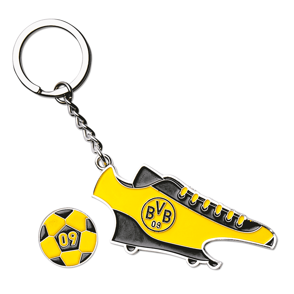 Porte-clés Borussia Dortmund en forme de chaussure de football noir et jaune, avec le logo du BVB, un jeton de caddie intégré et un décapsuleur.