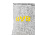 Calzini grigi in confezione da 3 con logo giallo del BVB sul bordo, merchandising ufficiale del Borussia Dortmund realizzato da PUMA.