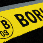 BVB bath towel with a black-and-yellow design and a large Borussia Dortmund emblem, size 100x150 cm, ideal for fans.