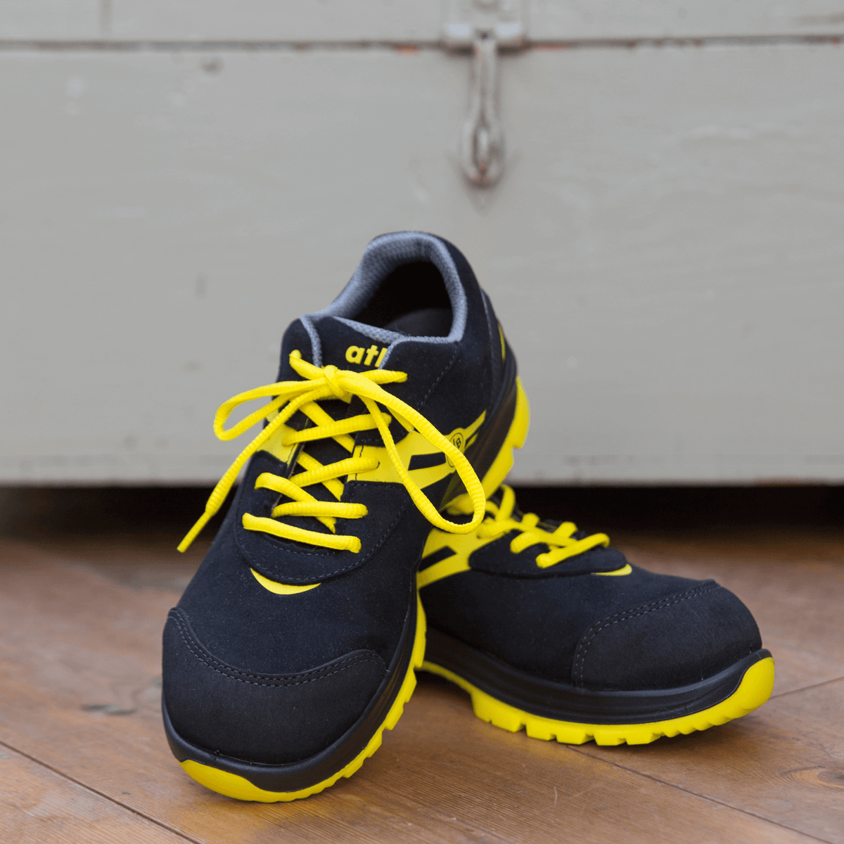 Black-and-yellow BVB Malocher 09 safety shoe, model S3, featuring an eye-catching design, yellow laces, and durable construction for everyday work.