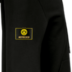 Gros plan sur un sweat à capuche noir du BVB réservé aux membres, orné du logo jaune « BVB-09 » et de l'inscription « Membre » en doré sur la manche.