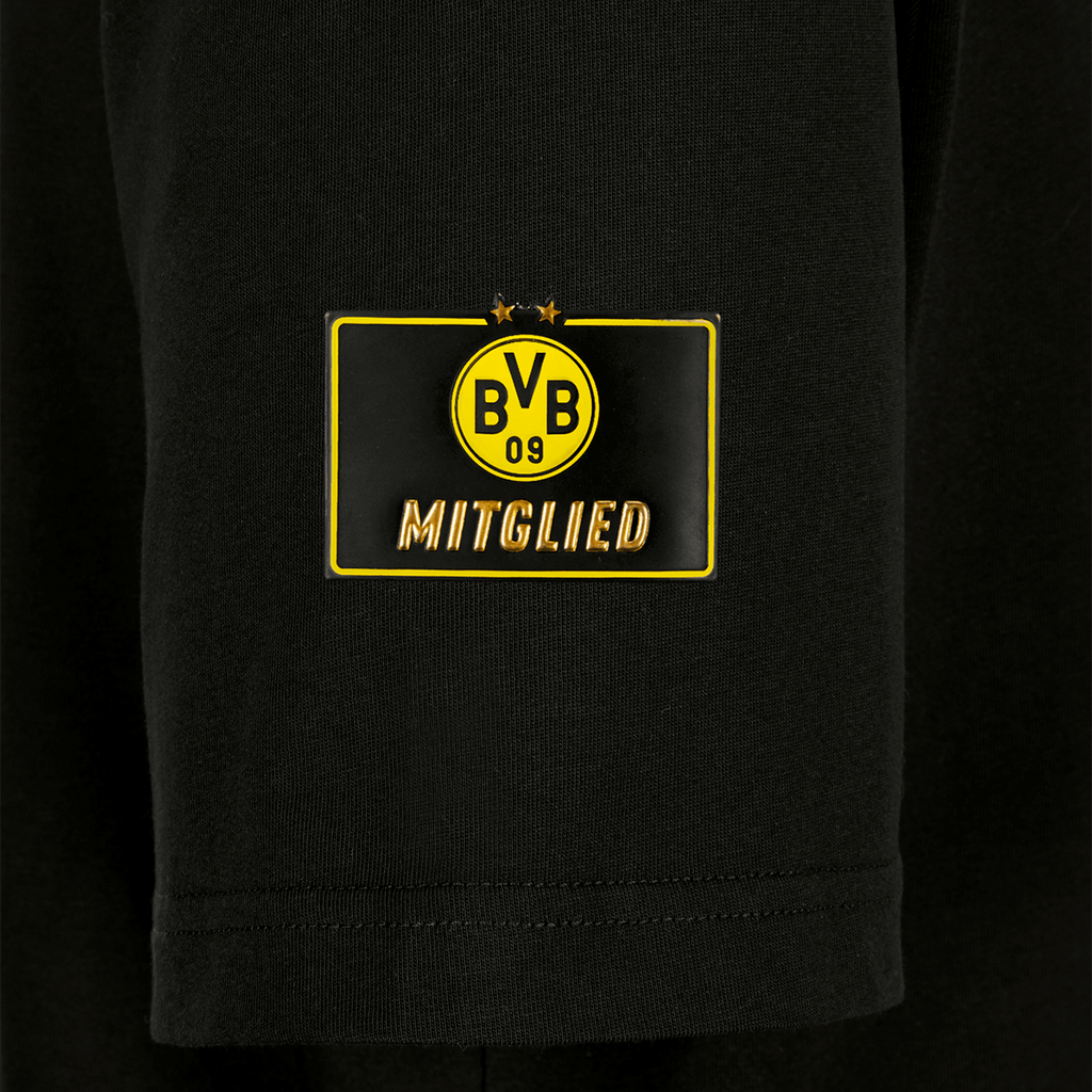 Maglietta nera da donna per i soci del BVB con logo giallo BVB-09 e scritta dorata “Mitglied” sul davanti, pensata per i tifosi del Borussia Dortmund.