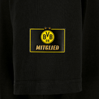 Maglietta nera da donna per i soci del BVB con logo giallo BVB-09 e scritta dorata “Mitglied” sul davanti, pensata per i tifosi del Borussia Dortmund.