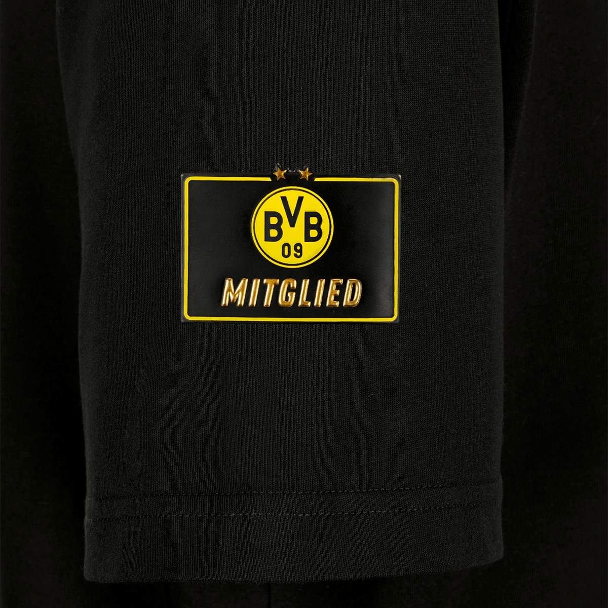 Camiseta negra de socio del BVB para mujer con el logotipo amarillo «BVB-09» y la inscripción dorada «Mitglied» en la parte delantera, diseñada para los aficionados del Borussia Dortmund.
