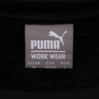 Camiseta negra de trabajo del BVB en varias tallas, fabricada por Puma, ideal para los aficionados del Borussia Dortmund.