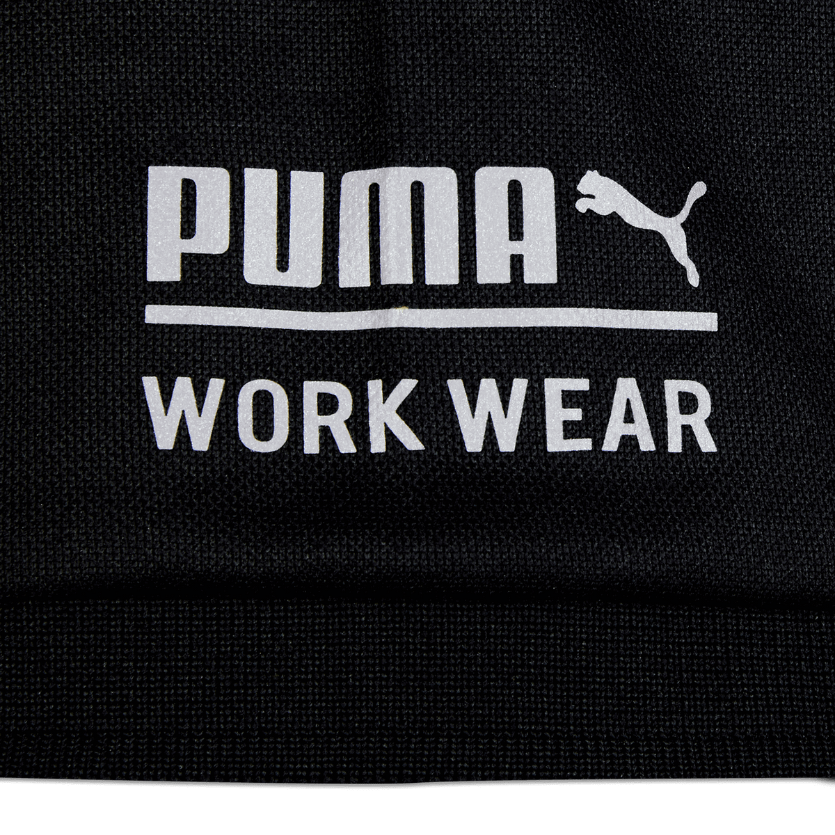 Schwarzes BVB-Poloshirt mit weißem 'PUMA WORK WEAR' Logo auf der Vorderseite.