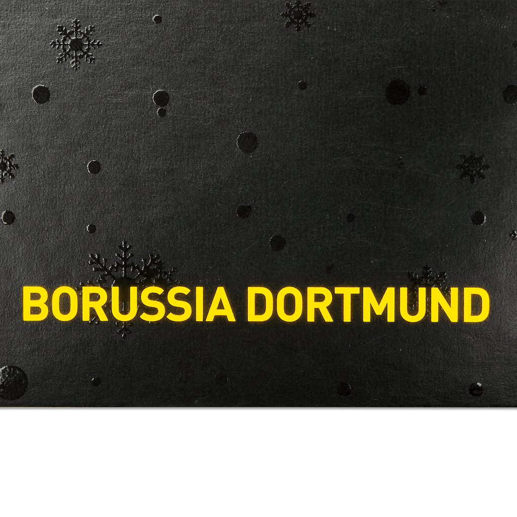 Biglietto di Natale nero del Borussia Dortmund con la scritta gialla "Borussia Dortmund" e fiocchi di neve decorativi a rilievo, ideale come gadget per i tifosi o come regalo.