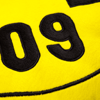 Cuscino rotondo del BVB con motivo nero e giallo, sfondo giallo e grande numero 09 ricamato in nero. L'accessorio perfetto per i tifosi del Borussia Dortmund.
