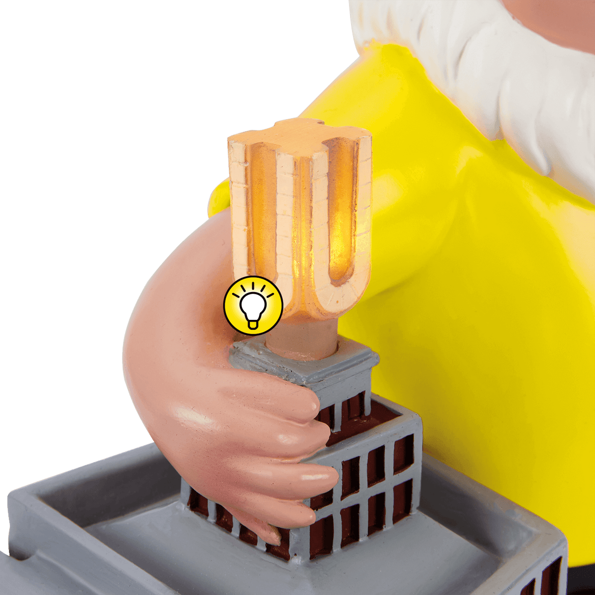 Dekorativer BVB-Gartenzwerg in gelbem Trikot mit beleuchtetem U-Turm-Modell in der Hand, ideal als schwarzgelbes Fanartikel.