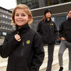 Black-and-yellow BVB softshell jacket for kids, modern design, front view with visible BVB emblem, suitable for outdoor activities.
