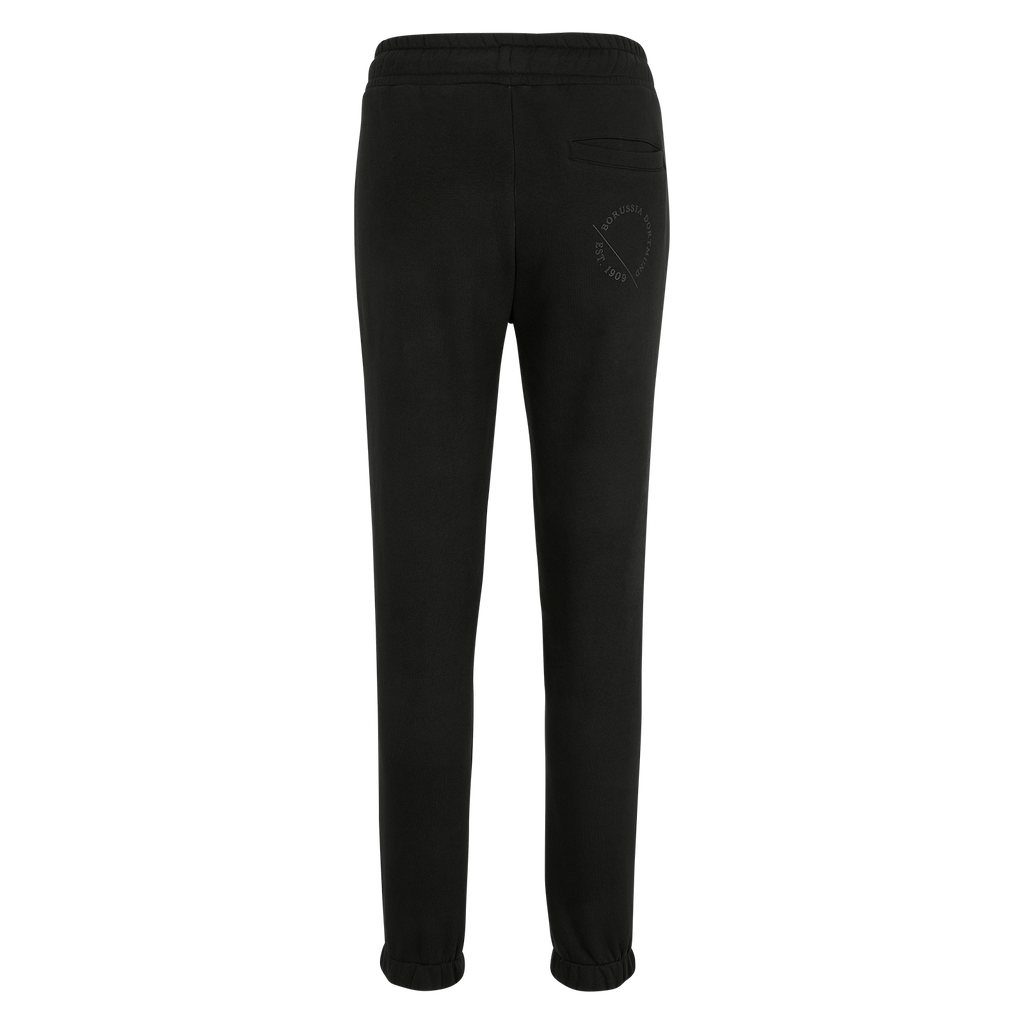 Vue arrière du pantalon de survêtement noir pour femme du BVB, orné du logo du BVB et de l'inscription « Est. 1909 », idéal pour les loisirs et le sport.