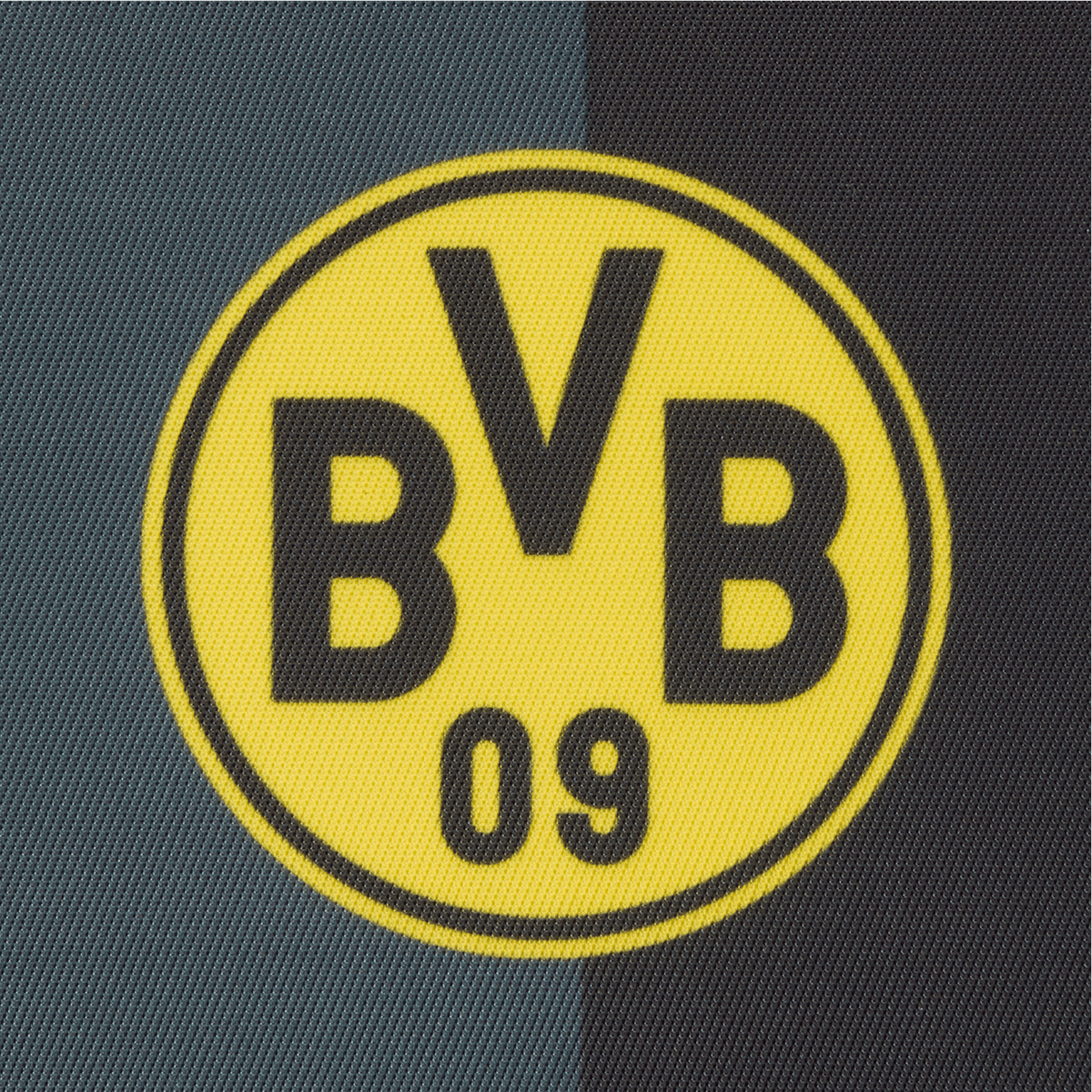 黑色与黄色相间的多特蒙德（BVB）官方徽标细节图，徽标上印有“BVB”字样和数字“09”，背景为带有纹理的深色。