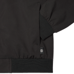 Schwarze BVB-Übergangsjacke mit dezentem BVB-Logo und gerippten Bündchen, ideal für die Übergangszeit.