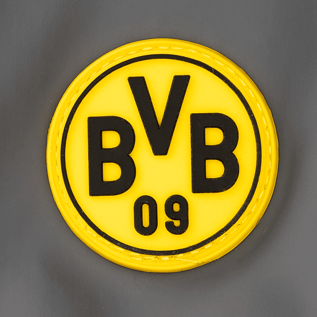 Pantalones impermeables del BVB para bebés y niños pequeños, en negro y amarillo, con el logotipo del BVB cosido en goma sobre tela gris.