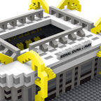 Maquette miniature du SIGNAL IDUNA PARK, le stade du Borussia Dortmund, avec ses couleurs noir et jaune caractéristiques et ses détails fidèles.