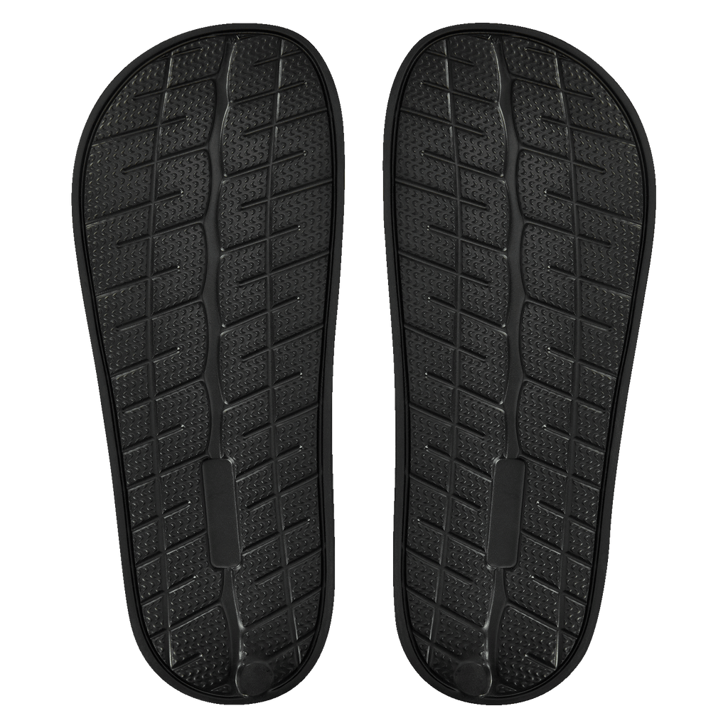 Chaussons de bain noirs avec le logo du BVB et une semelle antidérapante, vue de dessous.