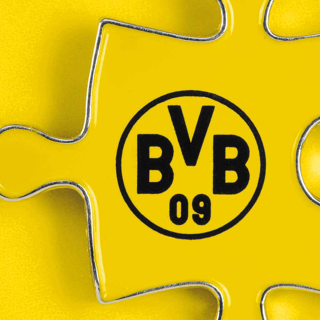 BVB Pin Set, consisting of two yellow puzzle pieces featuring the black BVB 09 logo, ideal for Borussia Dortmund fans.