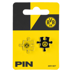 BVB Pin-Set bestehend aus zwei Puzzles in schwarzgelb mit BVB-Emblem, präsentiert auf einer passenden Verpackung in Vereinsfarben.