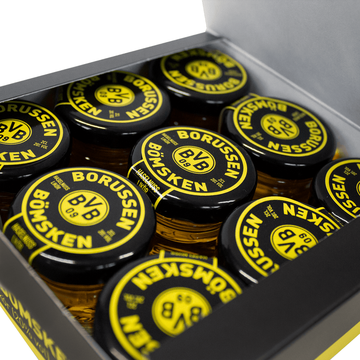Licor de avellanas Borussen BömSken en paquete de 9 unidades, con envase con el diseño en negro y amarillo del BVB, ideal como artículo para aficionados o como regalo.