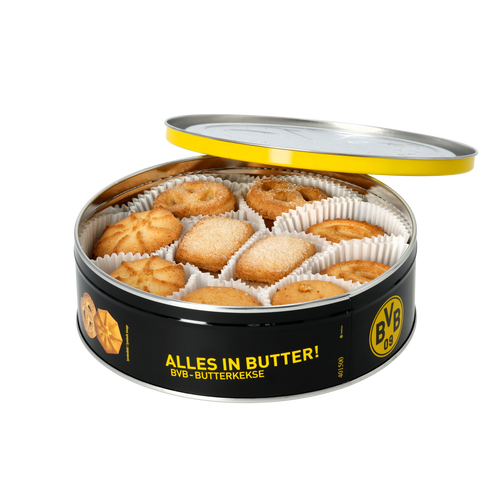 Schwarze runde BVB-Keksdose mit geöffnetem Deckel, gefüllt mit unterschiedlichen Butterkeksen in weißen Papierförmchen, gelber Rand und BVB-Emblem.