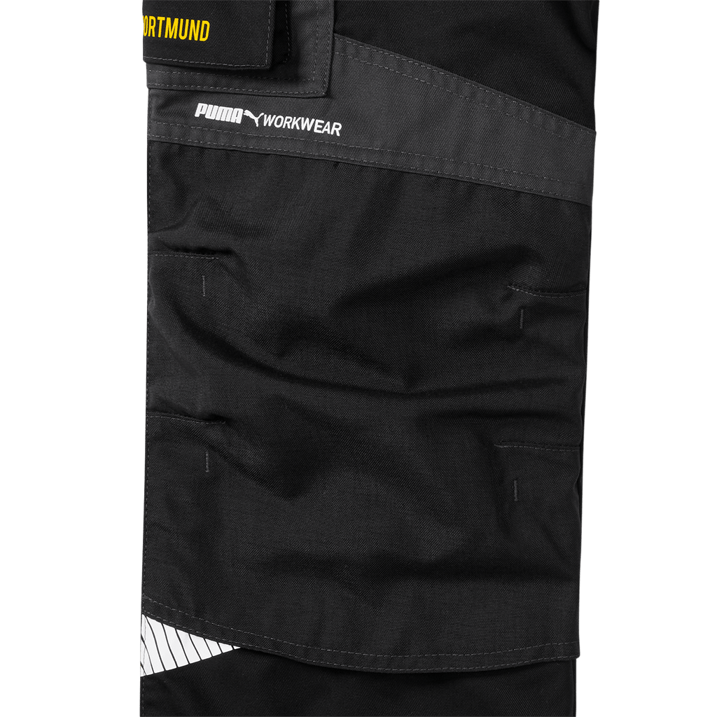 Close-up of the black-gray BVB work pants 23/24 with the PUMA logo and "Workwear" lettering, part of the current Borussia Dortmund collection.