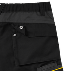 Close-up view of the black-and-yellow BVB work pants with functional pockets and durable material.