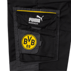 Close-up of the black BVB work pants featuring the yellow BVB 09 logo and the PUMA Workwear logo on the pocket.