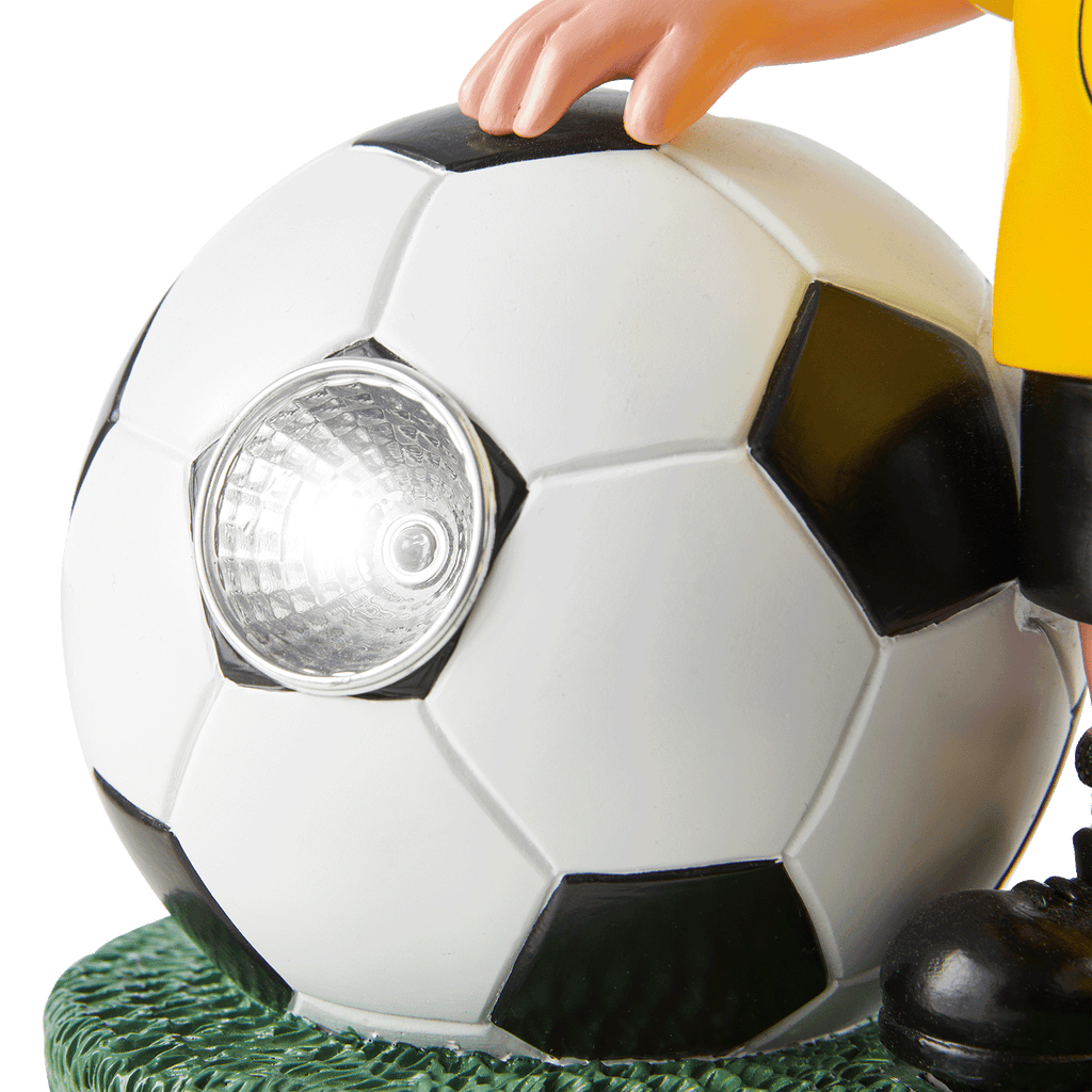 Black-and-yellow BVB garden gnome with an illuminated LED soccer ball, ideal as a decorative fan item.
