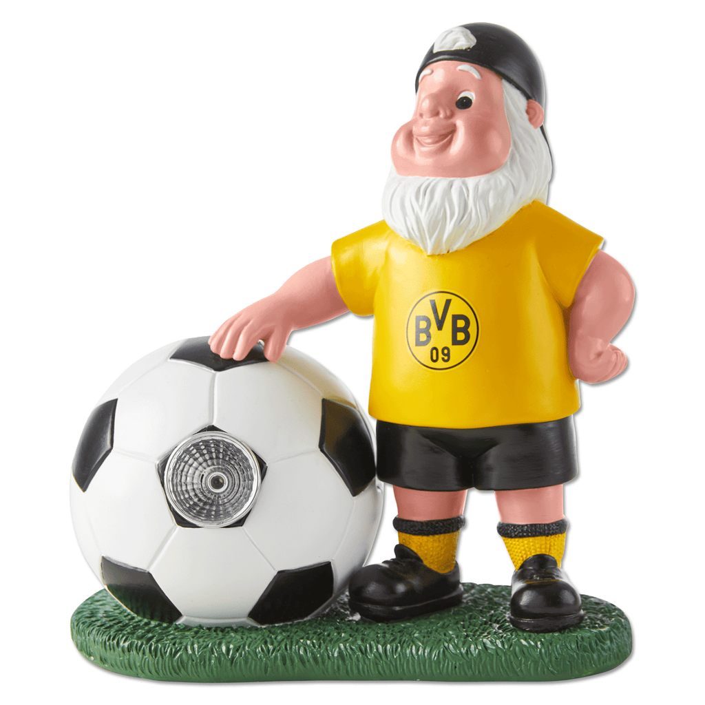 黒と黄色のユニフォームとパンツを着たBVBのガーデンノーム。LEDで光るサッカーボールを手にし、緑色の台座に乗っています。サッカーファンへのプレゼントや庭の装飾に最適です。