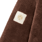 Brown BVB Teddy fleece jacket for women featuring a BVB 09 fabric label (detailed view), made of soft material.
