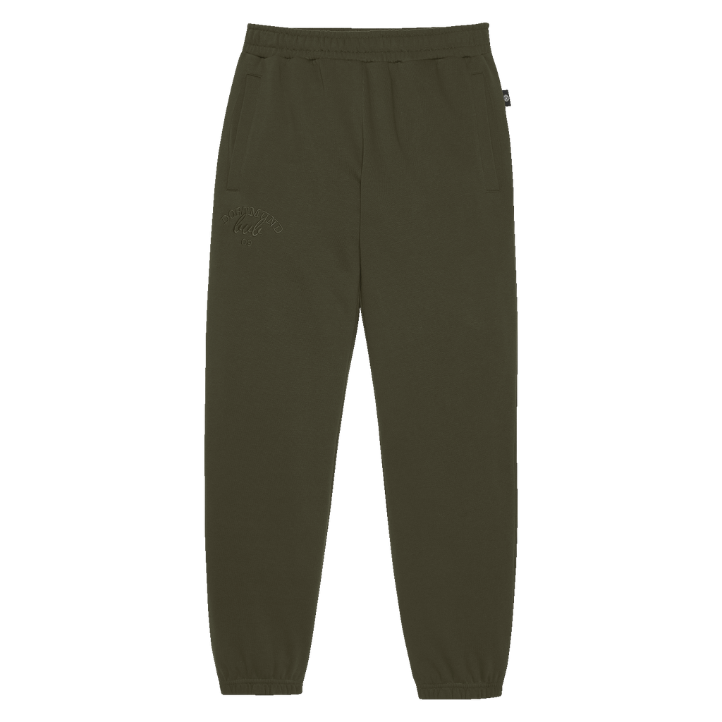 Pantaloni da donna BVB Drift di colore verde, con elastico in vita, tasche laterali e un discreto logo del Borussia Dortmund sulla gamba sinistra. Ideali per il tempo libero e lo sport.