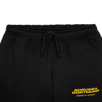 Pantaloni della tuta neri del BVB per bambini con logo giallo del Borussia Dortmund e coordinate, ideali per i tifosi.