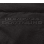 Close-up of a black BVB parka with embossed "Borussia Dortmund" lettering; high-quality fan merchandise design.