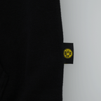Close-up of the BVB Explorer sweatshirt jacket featuring black fabric and a yellow BVB logo on the label.