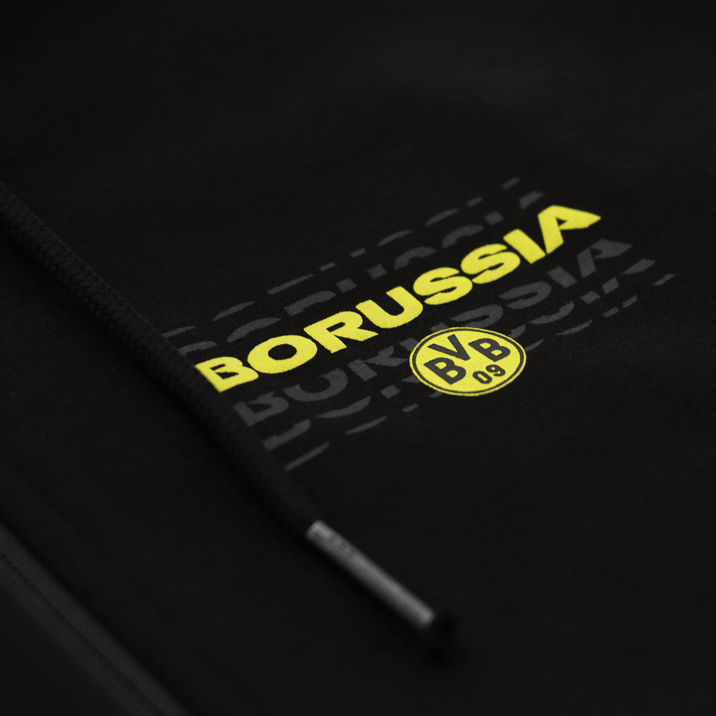 Réédition d'une veste de survêtement noire du BVB, ornée du logo jaune du Borussia Dortmund et dotée d'un cordon de serrage, idéale pour les supporters.