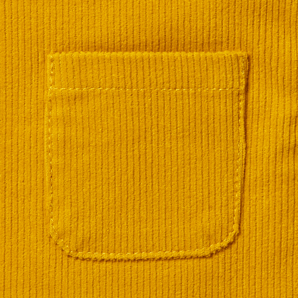 Close-up of yellow corduroy pants for babies and toddlers with a visible pocket, perfect for BVB fans.