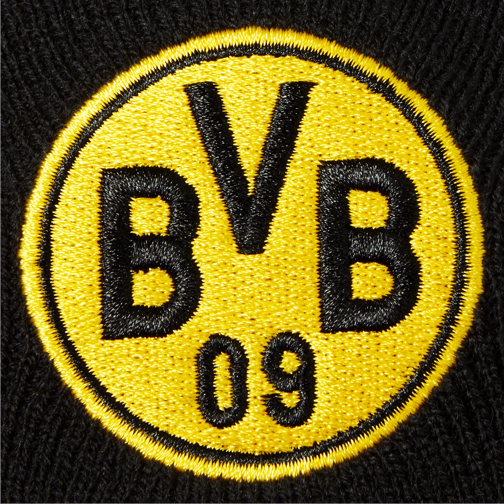 Close-up of a black-and-yellow reversible beanie from Borussia Dortmund featuring a prominent embroidered BVB logo.
