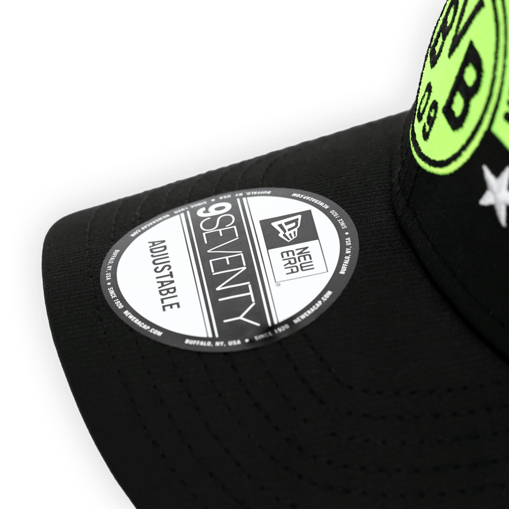 Black BVB cap in a retro design with a green Borussia Dortmund logo, adjustable, and a 9Seventy sticker on the front.