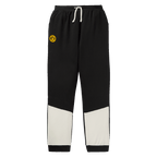 Pantaloni della tuta neri del BVB con dettagli bianchi e logo del BVB, ideali per i bambini e i tifosi del Borussia Dortmund.