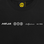 Schwarzes BVB-T-Shirt für Kinder mit Oversized-Passform, featuring weiße Schriftzüge 'Heja BVB', 'Ballspielverein', 'est. 1909' und BVB 09-Logo.
