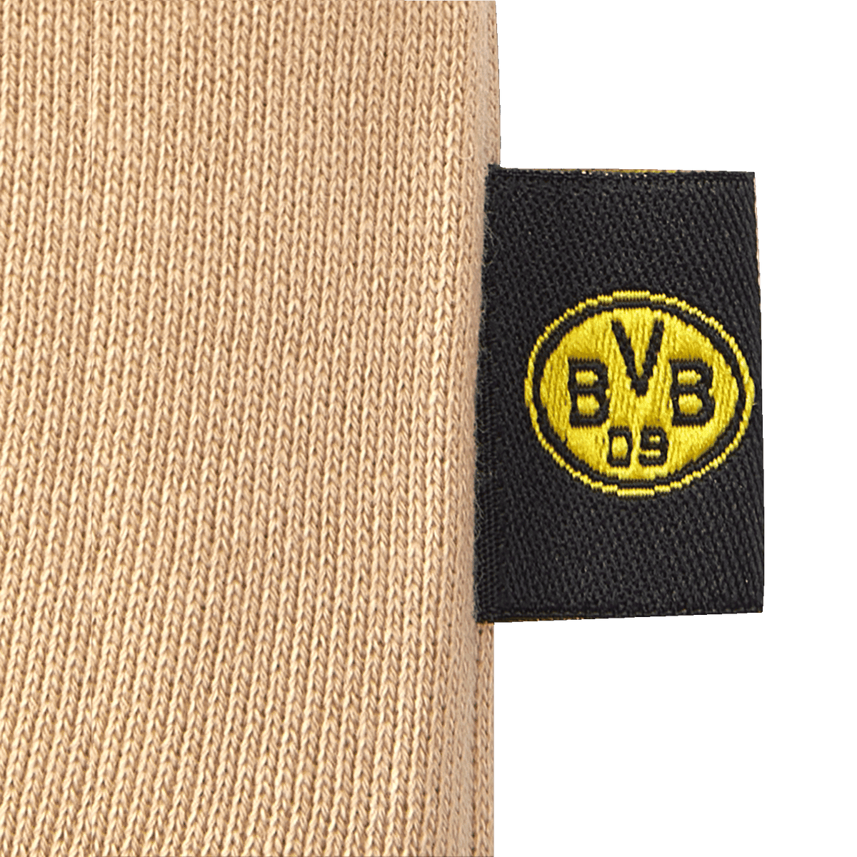Pantaloni da bambino del BVB color beige con logo BVB 09 nero e giallo integrato su un'etichetta: un articolo perfetto per i giovani tifosi del Borussia Dortmund.
