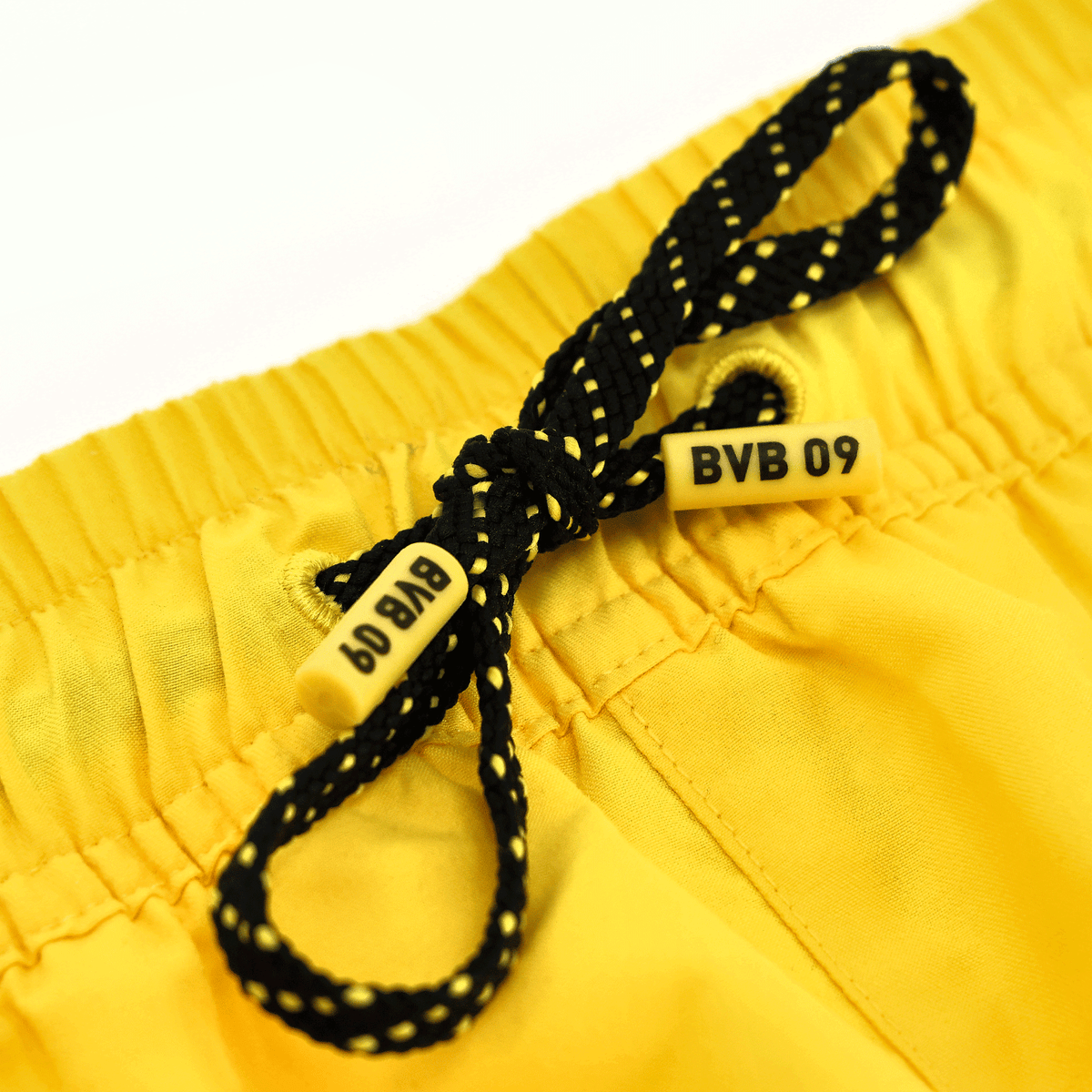 Men's swim trunks in yellow with a black-and-yellow drawstring and the BVB 09 logo, ideal as fan merchandise and for athletic activities.