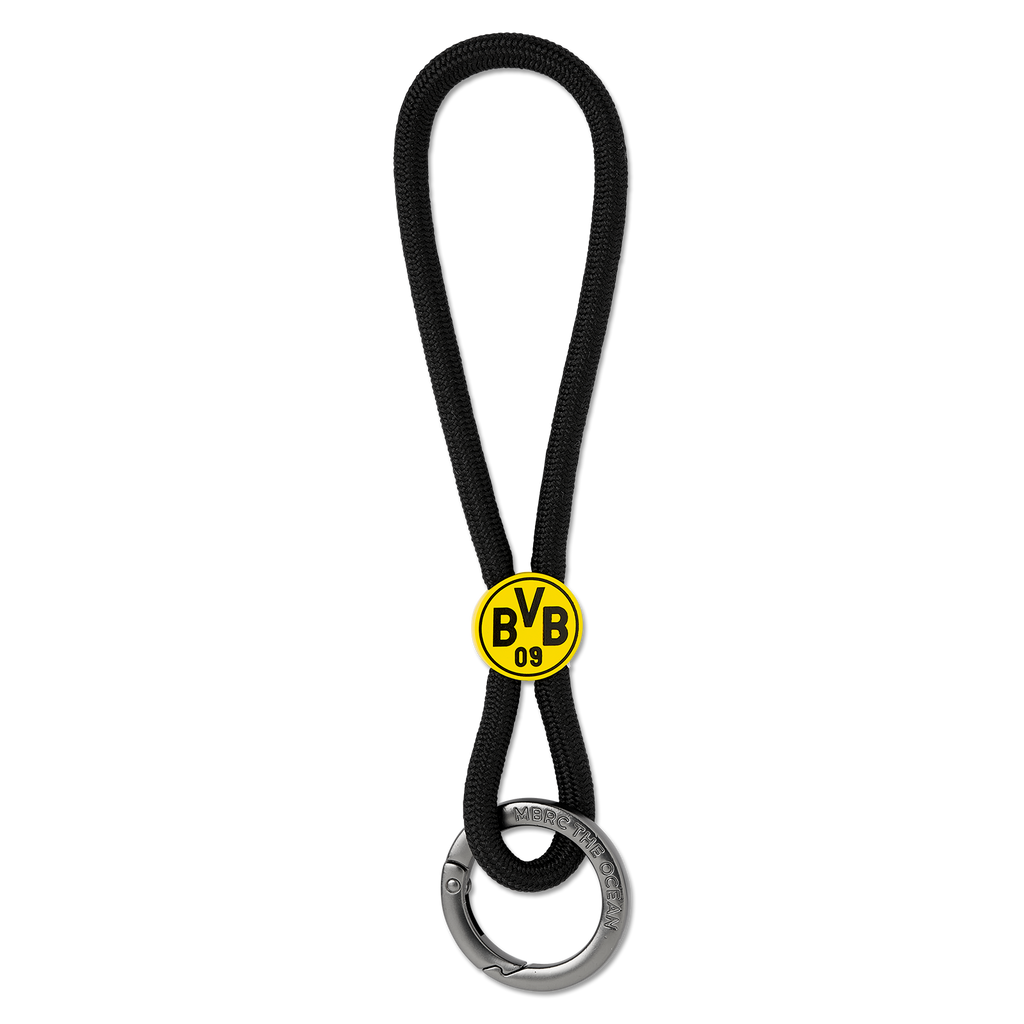 Porte-clés BVB en matière noire, orné d'un logo BVB-09 jaune bien visible et muni d'un anneau métallique robuste, idéal pour les supporters du Borussia Dortmund.