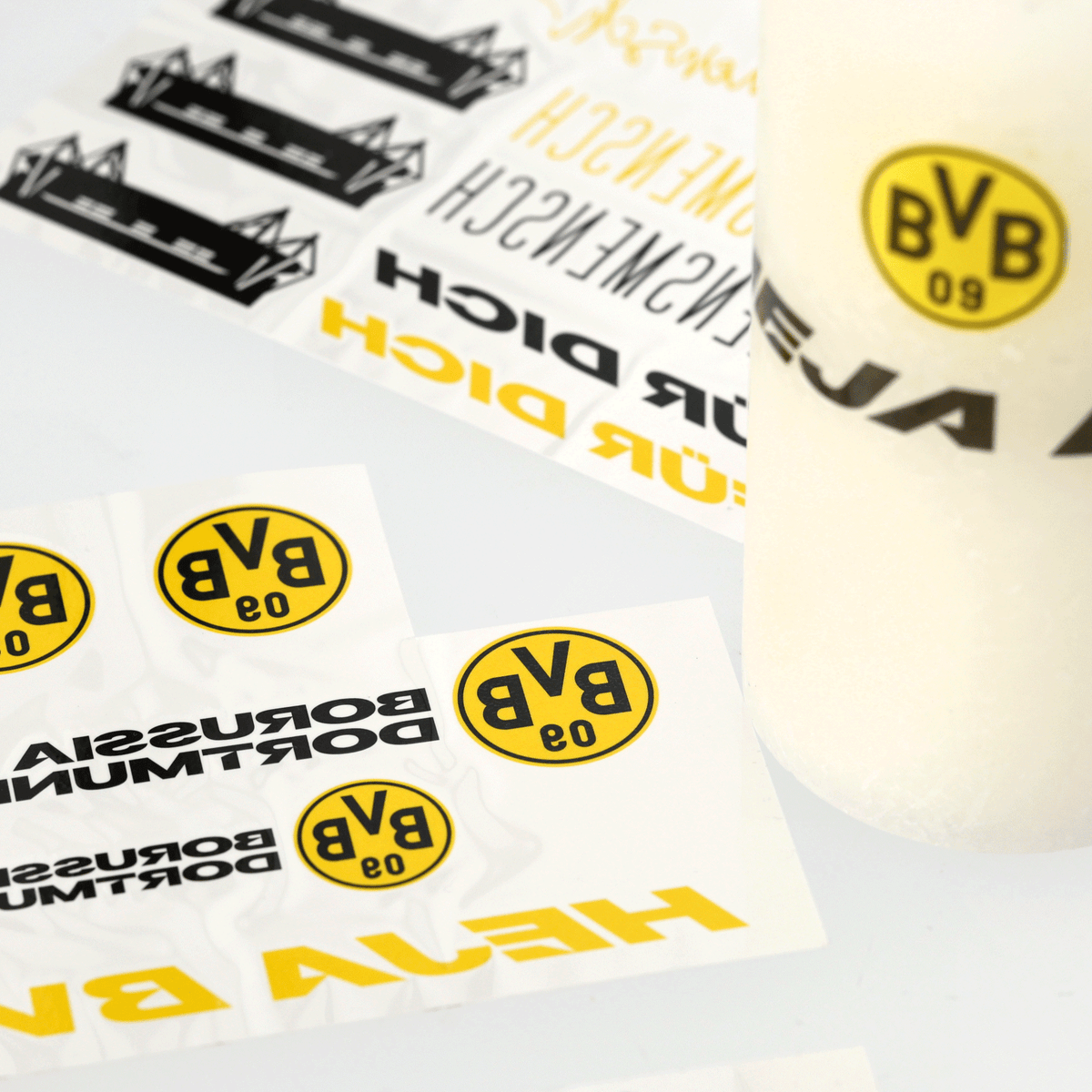 BVB Candle Wrapping Paper DIY Kit featuring various Borussia Dortmund designs in black and yellow, perfect for creative projects.