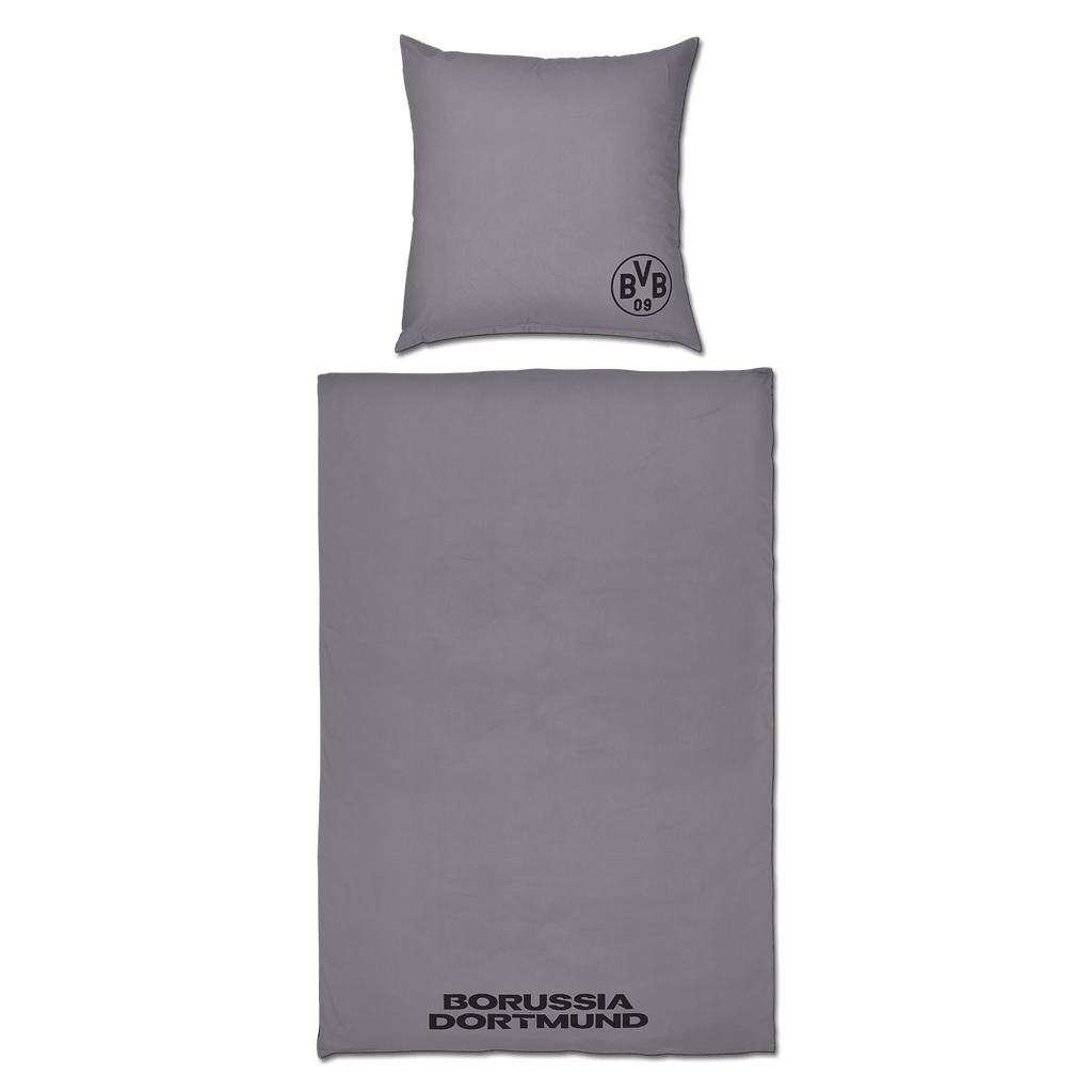 Juego de cama reversible del BVB en negro y amarillo, con la inscripción «Borussia Dortmund» en la manta y el logotipo del BVB en la almohada.