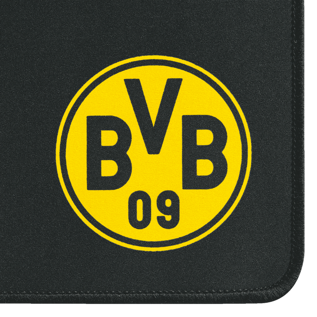 La alfombrilla para ratón gaming, con un diseño en negro y amarillo, luce el gran logotipo del BVB sobre un fondo negro y tiene los bordes redondeados.