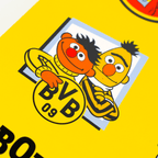 Borussia Dortmund sticker card featuring the Sesame Street characters Ernie and Bert against a yellow background with the BVB logo.