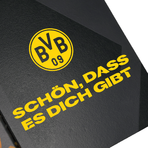 Cadre photo noir orné du logo jaune du BVB et de l'inscription « Schön, dass es dich gibt ». Un article idéal pour les supporters du Borussia Dortmund.